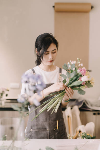istock A young florist who makes bouquets 1388575853