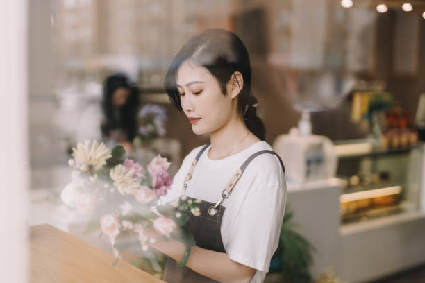 istock A young florist who makes bouquets 1388575887