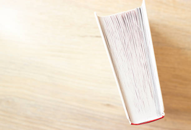 istock closeup book on wooden floor 1388577021
