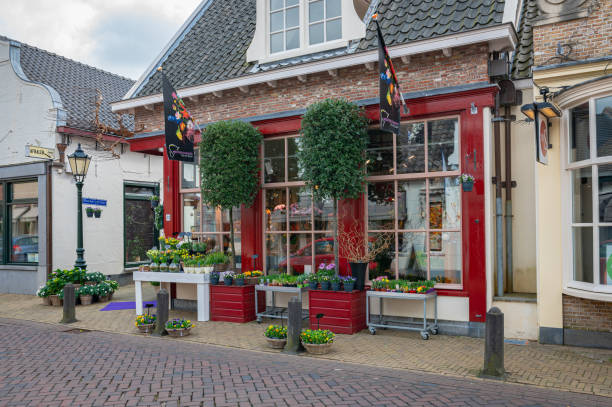 Nieuwerkerk aan den IJssel, Netherlands - March 2022: Flower shop in Dutch style in a small town close to Gouda, Holland.