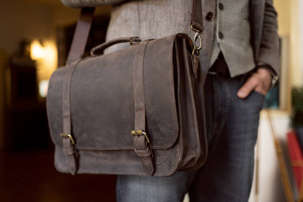 istock Unrecognizable businessman with leather briefcase 1388578980