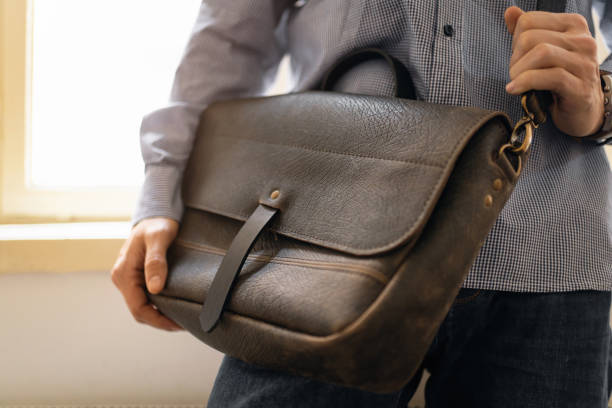 istock Unrecognizable businessman with leather briefcase 1388579087