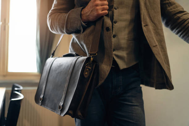 istock Unrecognizable Caucasian businessman with leather briefcase 1388579314