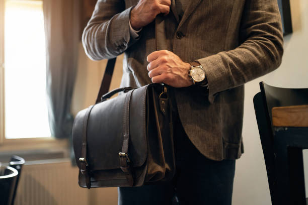 istock Unrecognizable businessman with leather briefcase 1388579320
