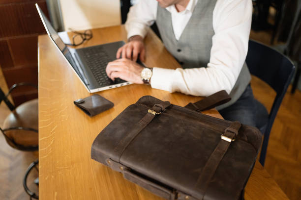 istock Unrecognizable businessman working on laptop 1388579482