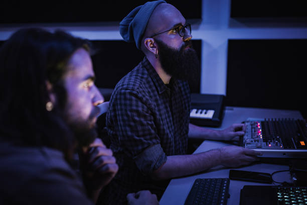 istock Two producers working in the music studio 1388581033