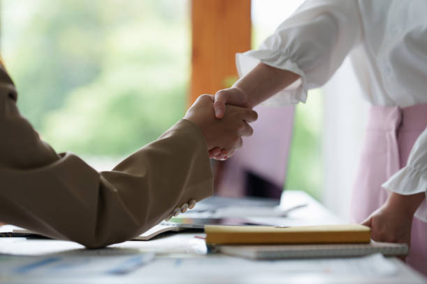 istock Business people successful negotiation and handshake. celebration partnership and teamwork, business deal concept. 1388581443