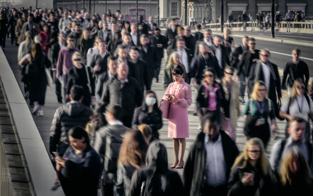istock CEO dressed in pink using smart phone on London Bridge 1388581571