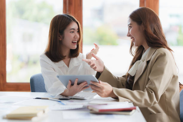 istock Group of IT consultant working together and management big data and analyze financial document of company. 1388582717