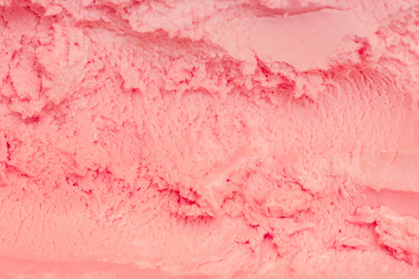 istock Ice cream surface texture. Strawberry ice cream background 1388582779