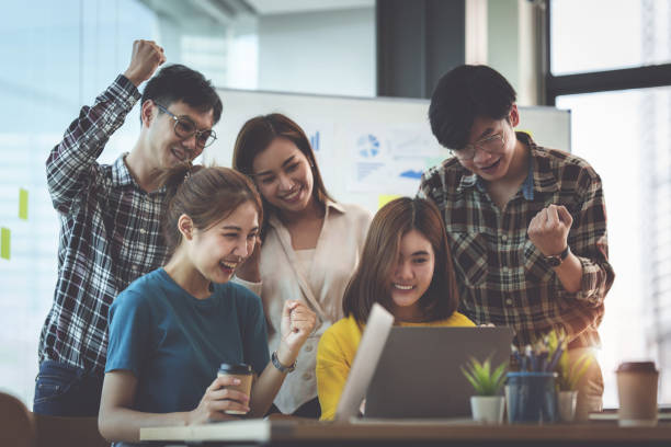 istock Group of young people at library in college campus. 1388582802