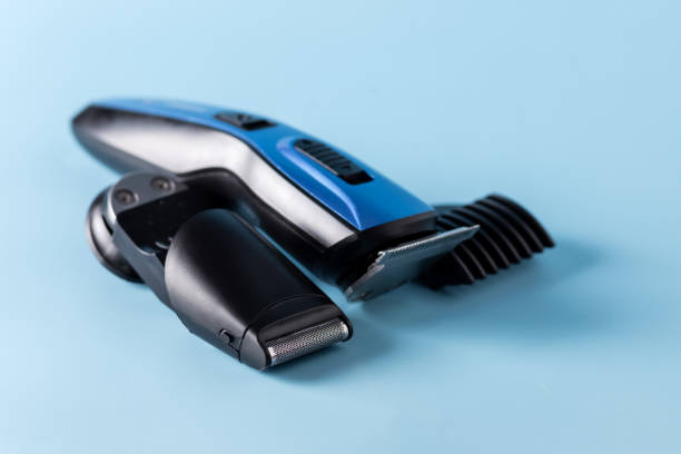 istock Modern Battery Electric Shaver for Man on Blue Background with Clipping Path Horizontal 1388583793