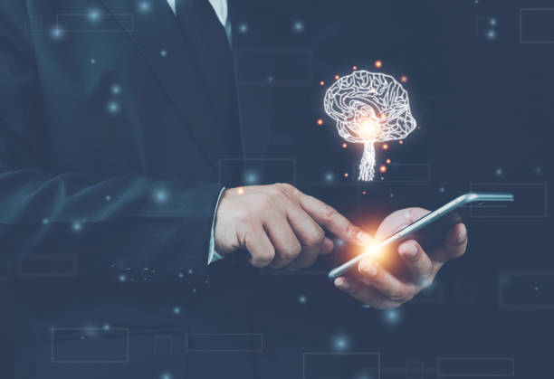 istock Businessman using phone,with brain icon,creativity and innovative are keys to success,new ideas and innovation concept, innovative technology in science and medicine concept. 1388585545