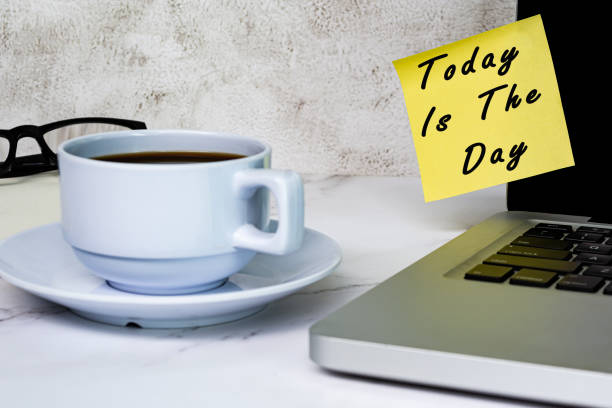 istock Inspirational quotes - Today is the day text on sticky note on a computer screen 1388589489