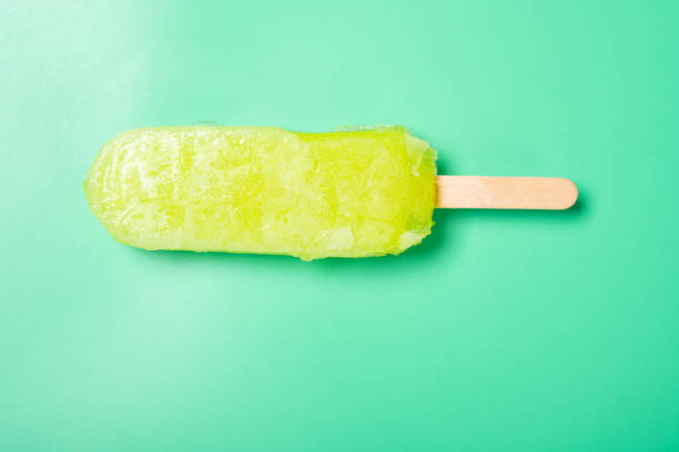 istock top view fresh green popsicle on a green background 1388591571
