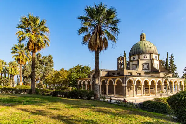 The Church of the Beatitudes is a Catholic church of the Italian Franciscan convent on the Mount of Beatitudes. Magnificent monastery surrounded by columns and slender tall palms