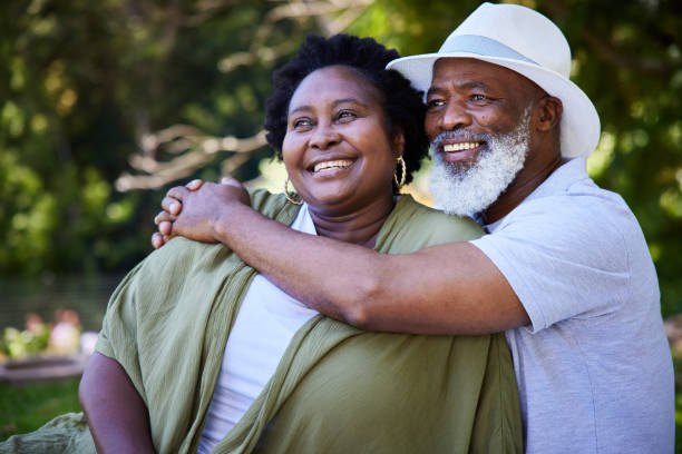 istock Affectionate mature couple looking at the view during a picnic 1388594493