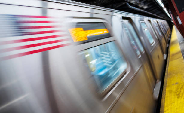 istock Blurred train arriving at the platform of a subway station 1388598113