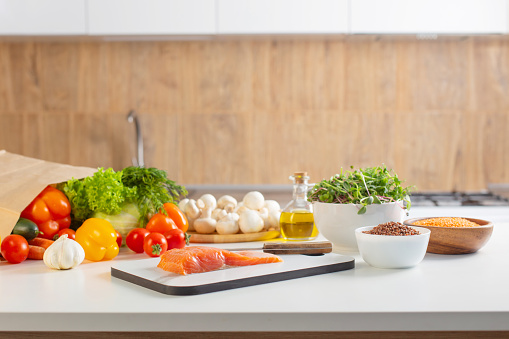 red fish and various vegetables in  kitchen