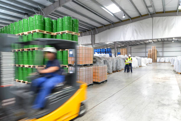 istock group of workers in the logistics industry work in a warehouse with chemicals 1388599341