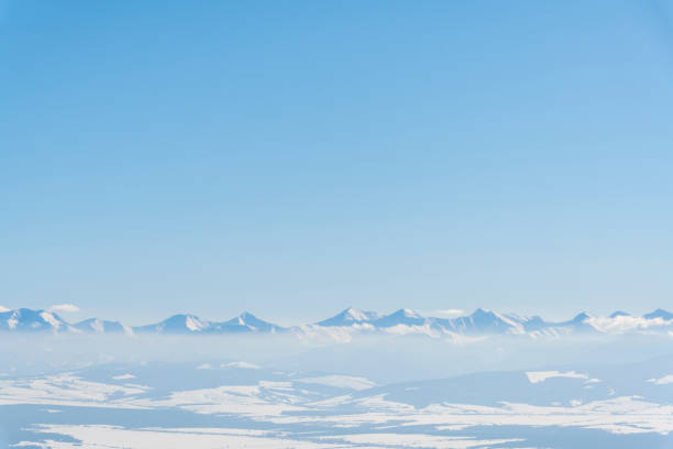 The Tatra Mountains, seen from a distance from Babia Góra on a beautiful sunny day, southern Poland.