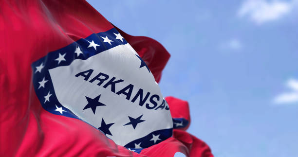 The state flag of Arkansas waving in the wind stock photo