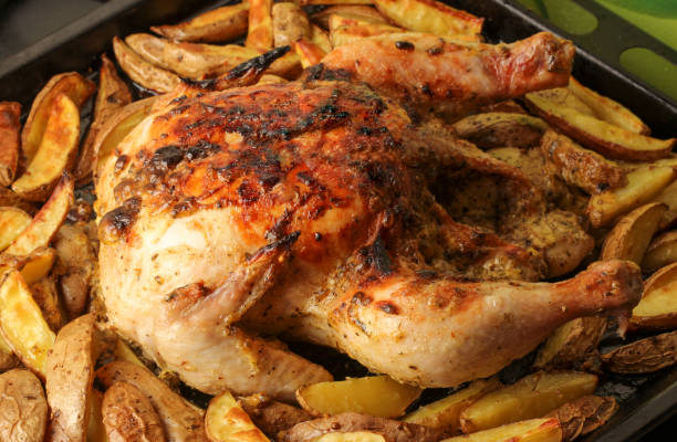 istock Baked chicken with potatoes 1388603617