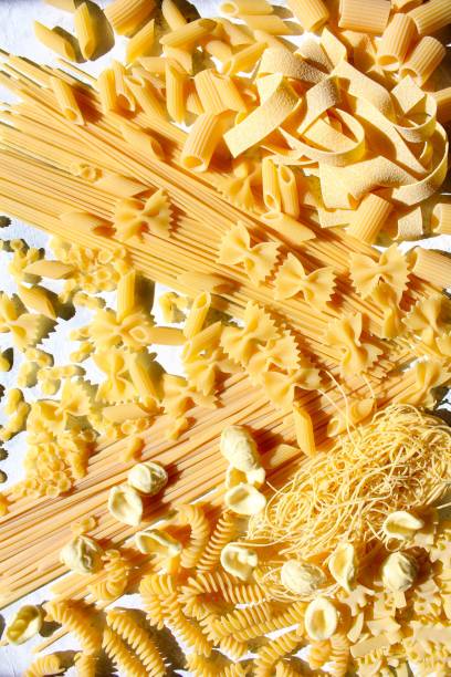 istock Variety Italian pasta on light background. 1388603778