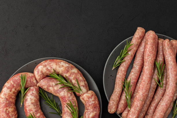 istock Raw pork sausages with rosemary 1388604624
