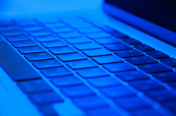 istock laptop keyboard close up with RGB lighting, side view 1388605624