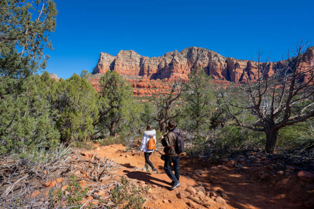 istock Couple  on spring hiking trip in red mountains. 1388606335