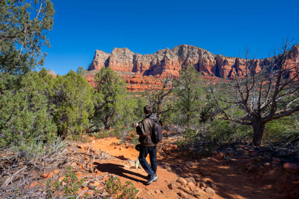 istock Man on spring hiking trip in red mountains. 1388606338