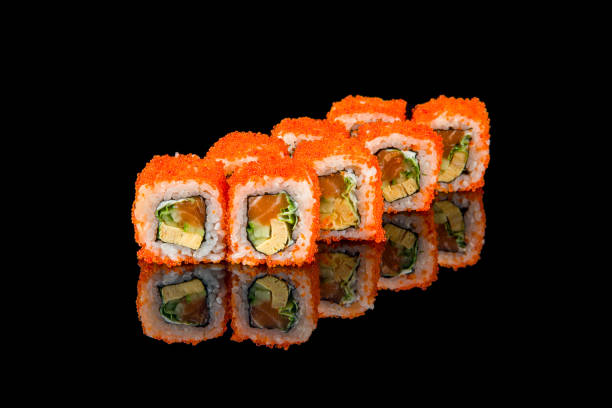 istock California roll with salmon on black with reflection 1388607577