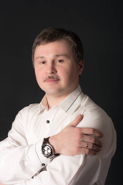 istock confident man in a white shirt 1388610614