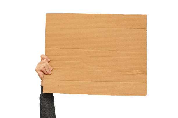 istock Posters of cardboard in his hands. Isolated on white. Copy space. 1388612026