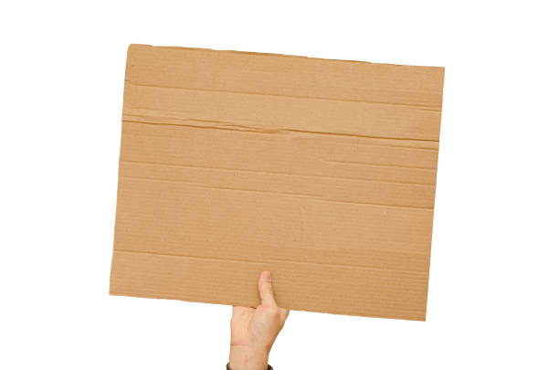 istock Posters of cardboard in his hands. Isolated on white. Copy space. 1388612031