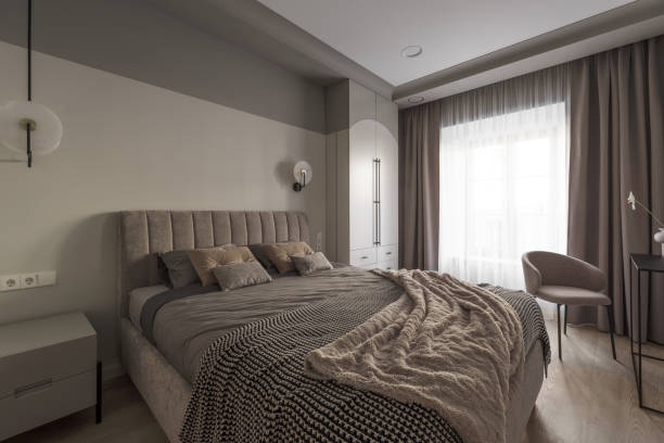 istock Modern bedroom interior in pastel colours. Trendy minimalistic interior concept 1388612423