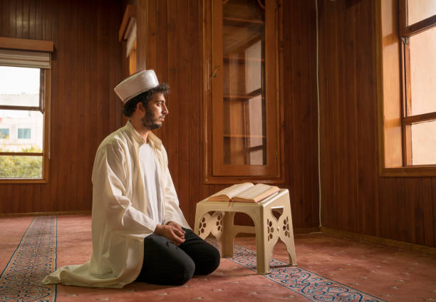 istock Muslim cleric praying in mosque. 1388618644