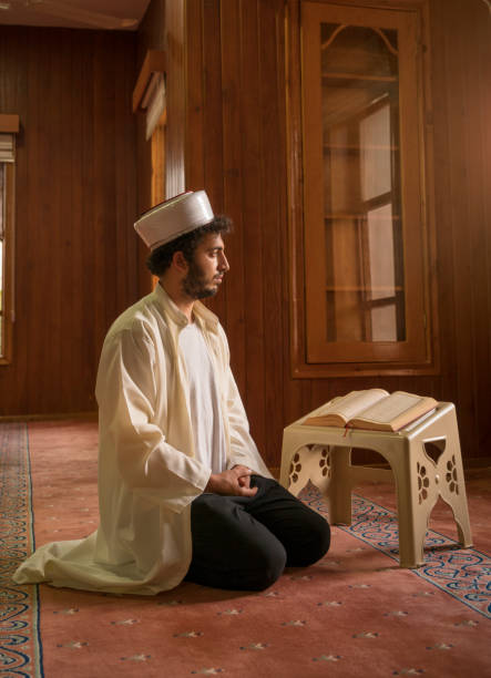 istock Muslim cleric praying in mosque. 1388619743