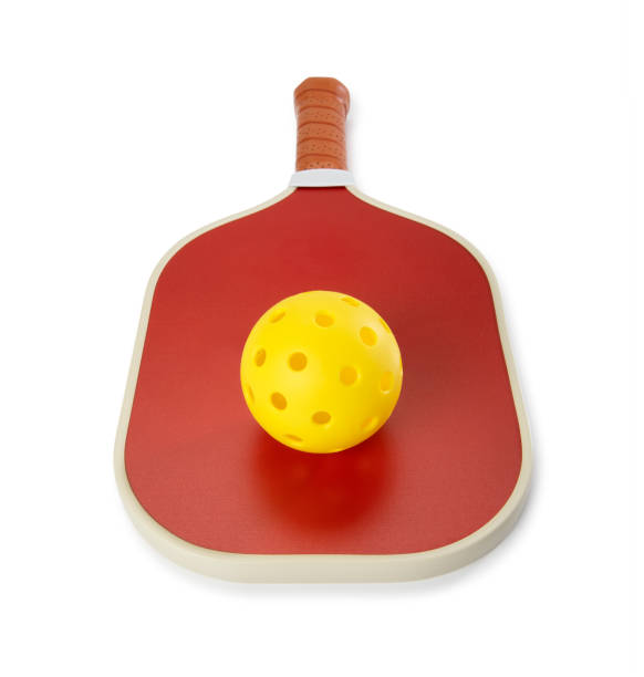 istock Pickleball Paddle and Balls on a court 1388619808