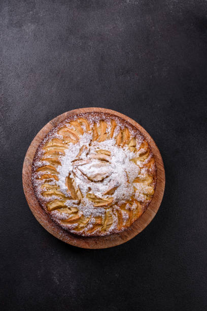 istock Apple pie with fresh fruits on a wooden table 1388623055