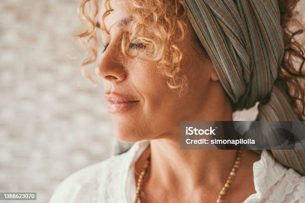 Wellbeing And Healthy Lifestyle Serene Woman Expression Side Portrait Of Female People In Meditation Middle Age Pretty Lady With Closed Eyes And Peaceful Feeling Concept Of Happiness Inside Stock Photo - Download Image Now