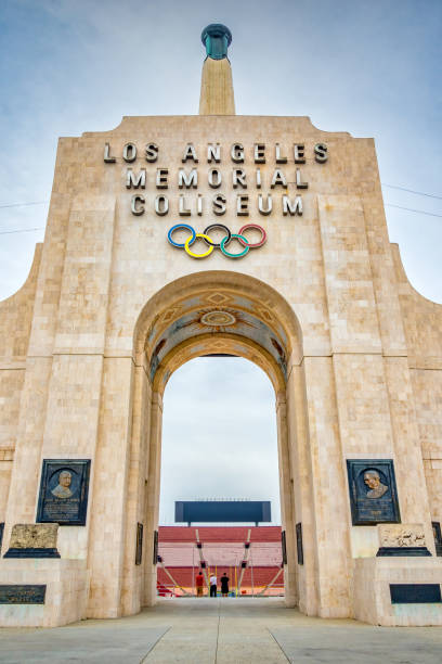 The Los Angeles Memorial Coliseum, a historic stadium in Los Angeles, California, USA on a cloudy day.