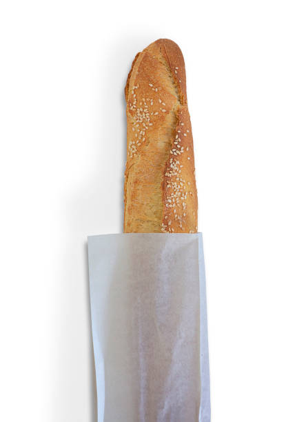 istock Baguette on paper bag isolated on white 1388624754