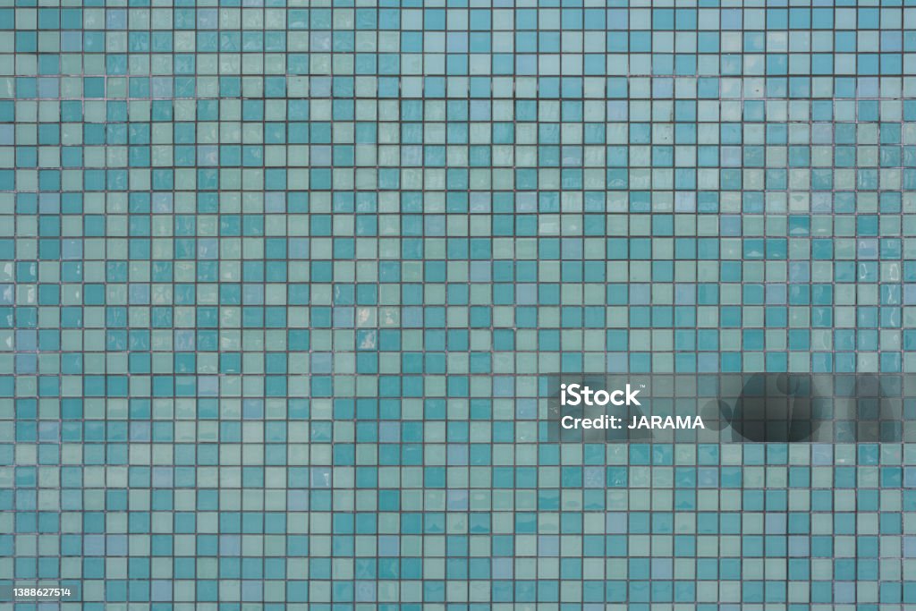 texture of a teal wall background Close up of a a wall, tiled with square ceramic tiles Tiled Floor Stock Photo