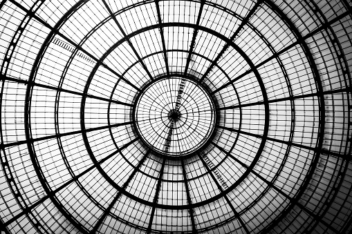 Directly below shot of sunlight seen through patterned glass dome in Galleria Vittorio Emanuele II