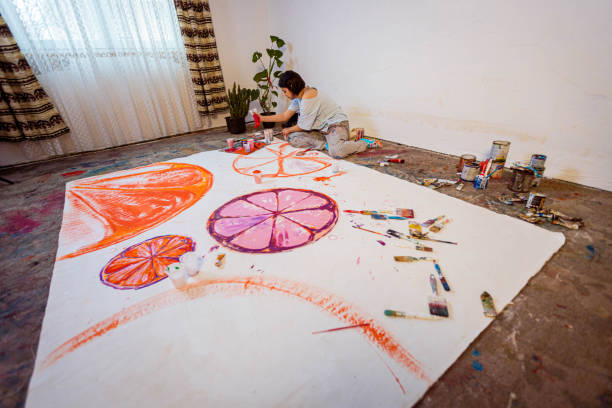 istock Young artist painting in her studio 1388629131