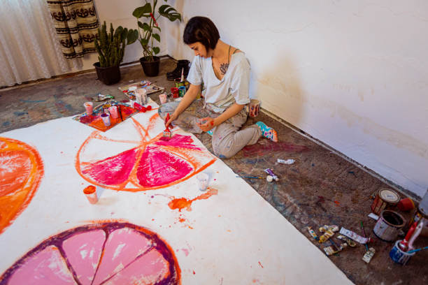 istock Young artist painting in her studio 1388629155