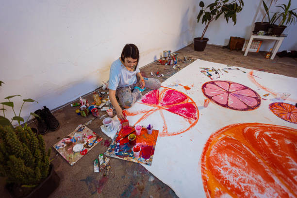 istock Young artist painting in her studio 1388629172
