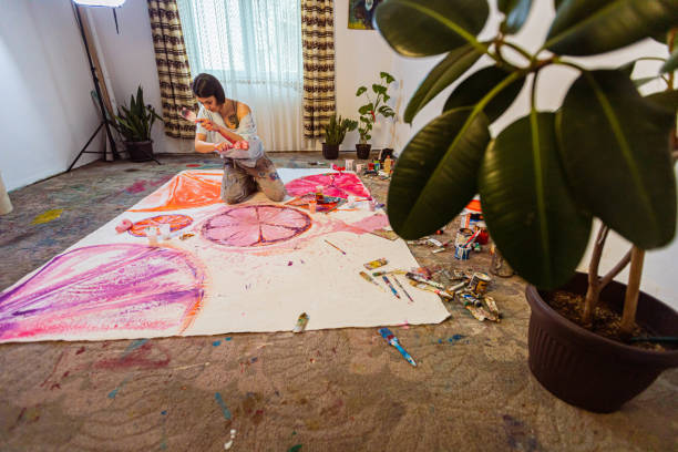 istock Unique artist painting oil on canvas in his art studio 1388629366